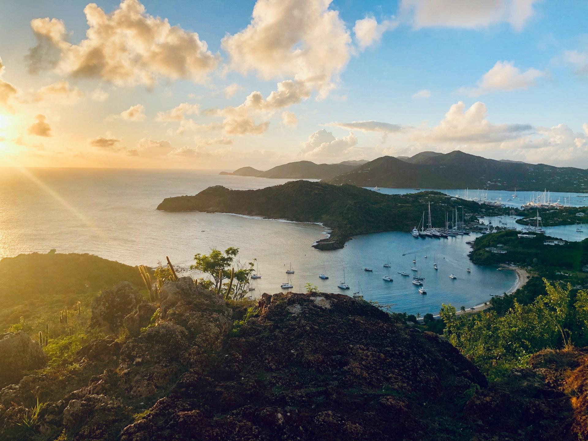 Sailboats in a sheltered bay at sunset in Antigua and Barbuda