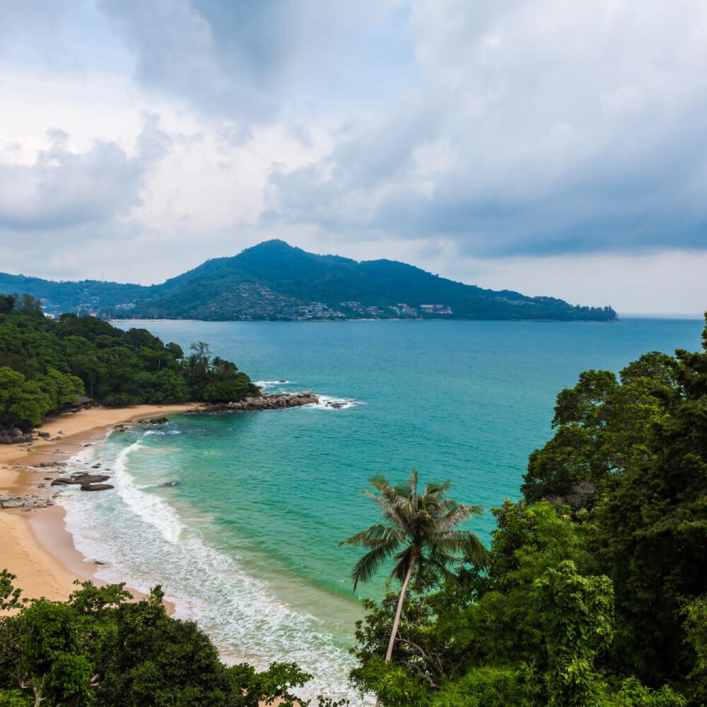 A wooded coastal headland overlooking the sea in Dominica