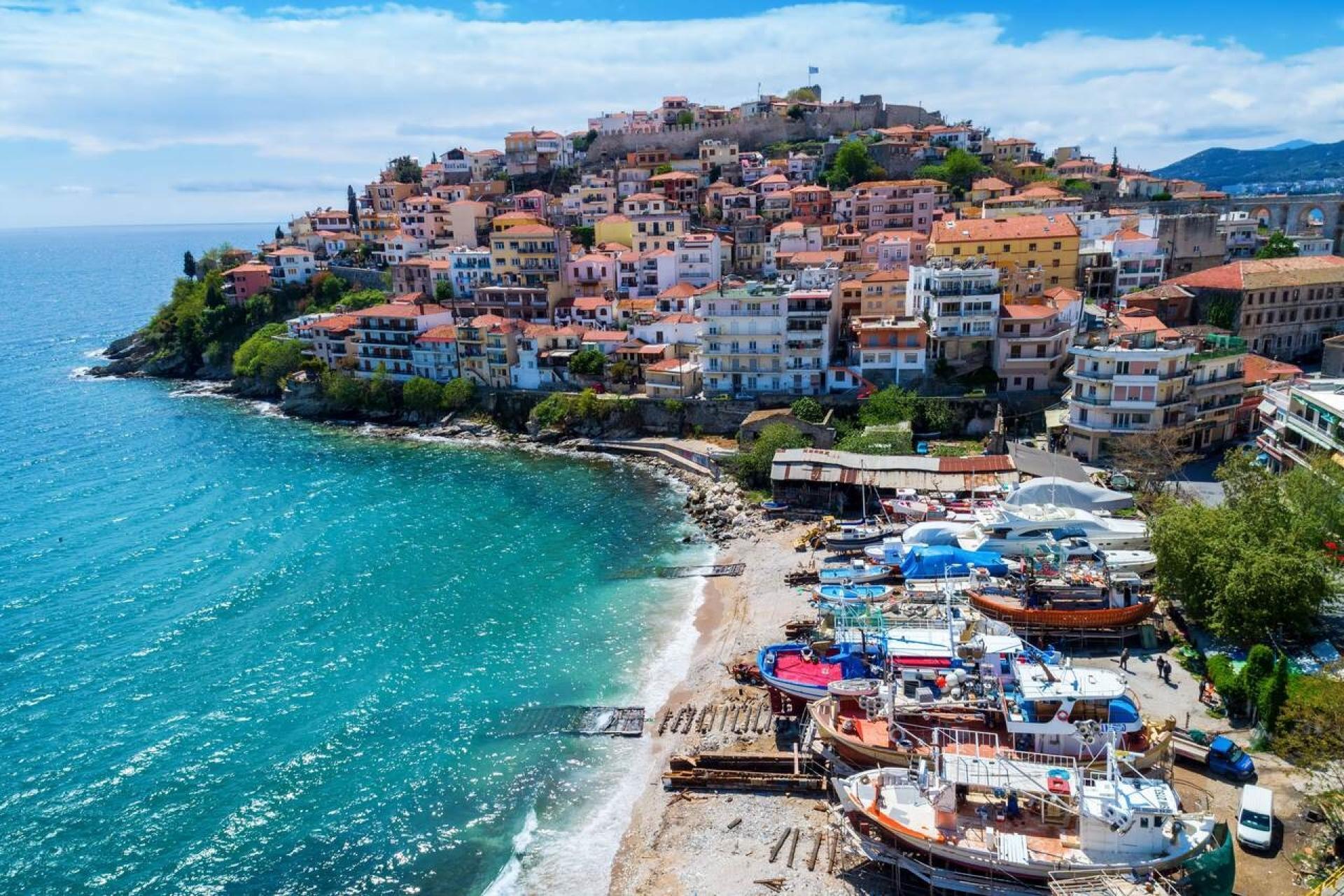 An old Greek town of tiled roofs above the sea