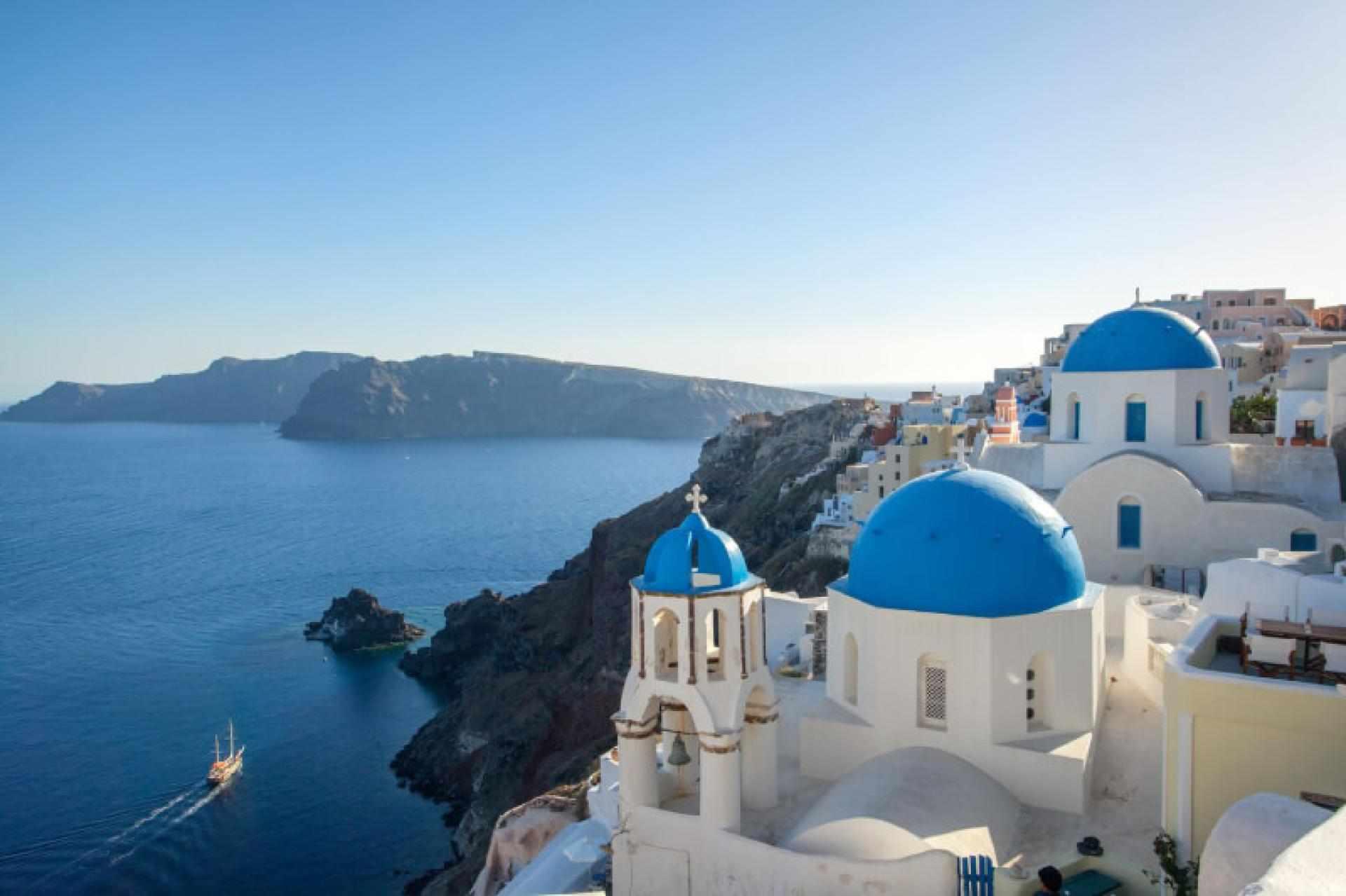The blue domes of Oia above the caldera in Santorini