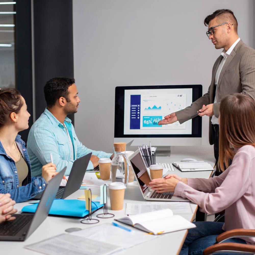 Advisers discussing paperwork during a consultation