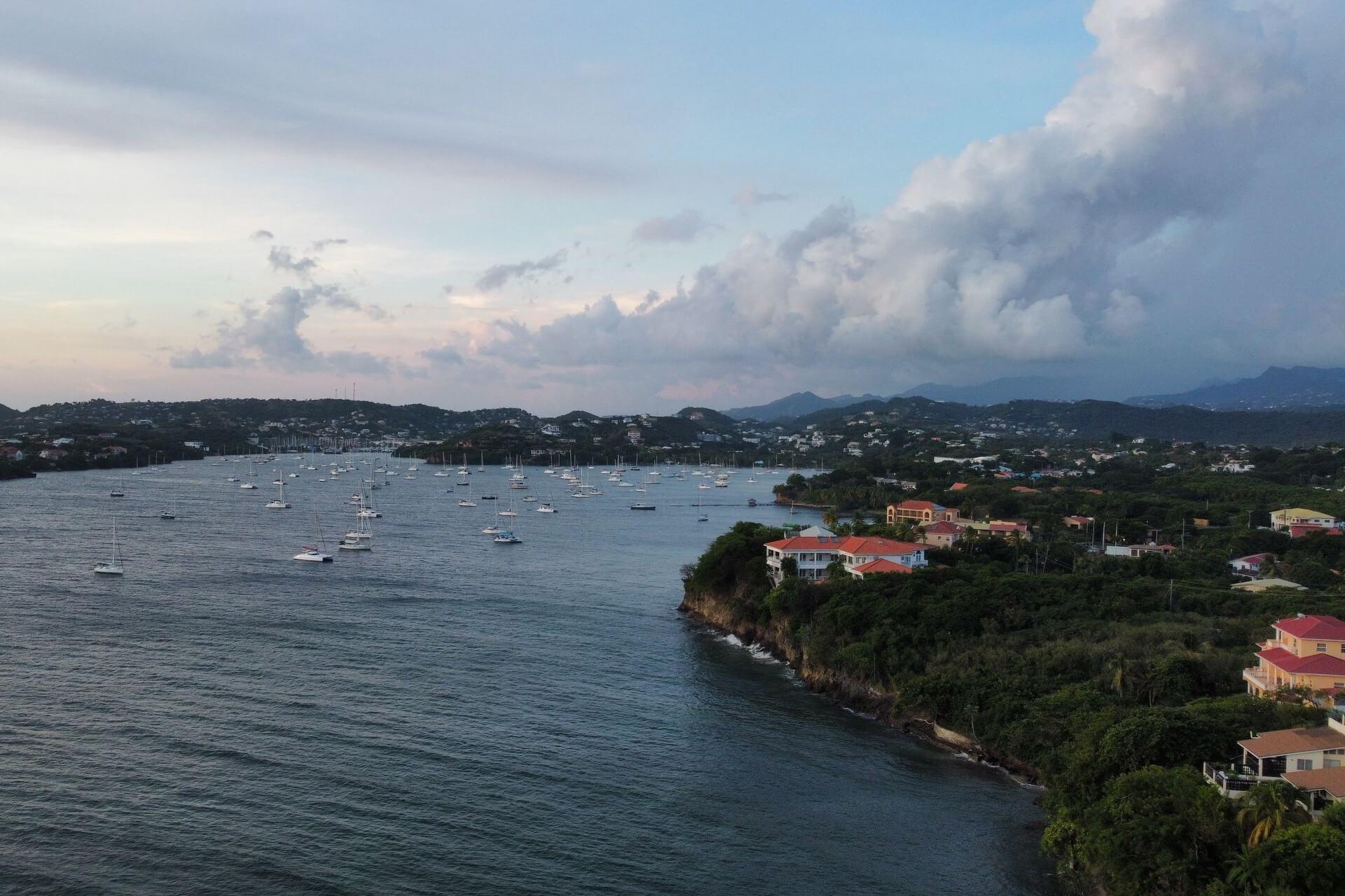 A picturesque aerial view of boats anchored in a scenic coastal bay at twilight, Saint Lucia
