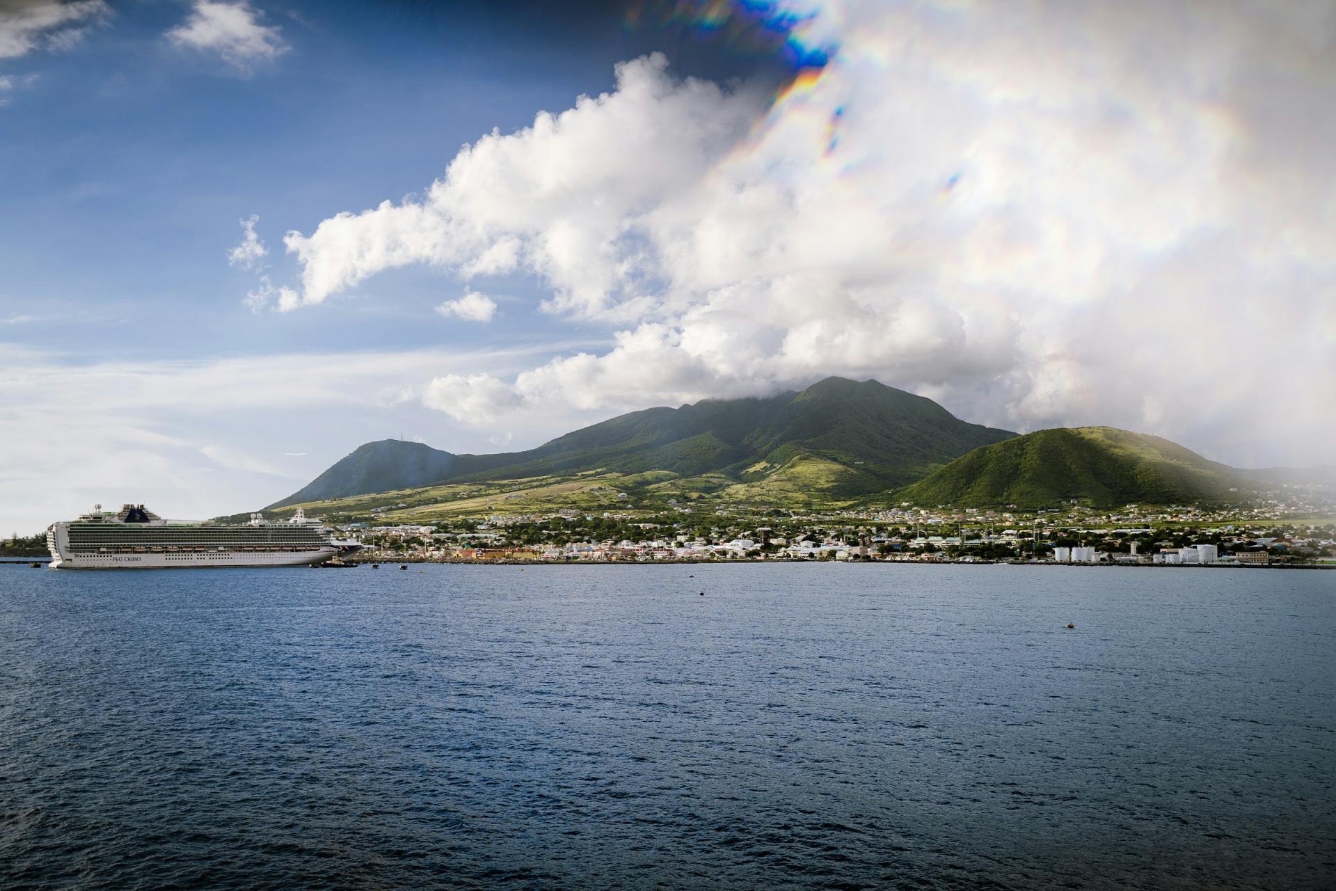 Basseterre waterfront and a cruise ship beneath the green mountains of St Kitts