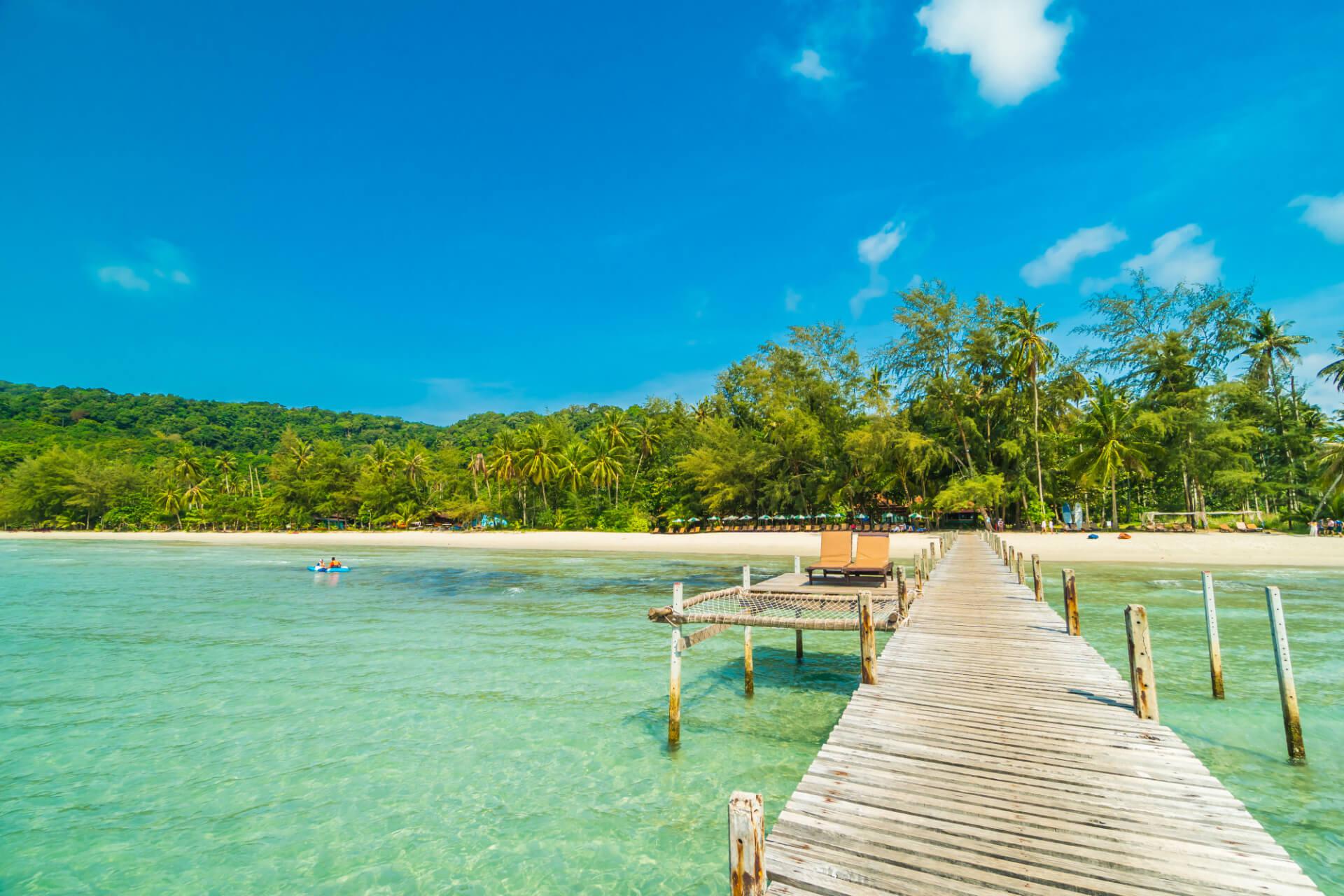 Wooden pier or bridge with tropical beach, Vanuatu