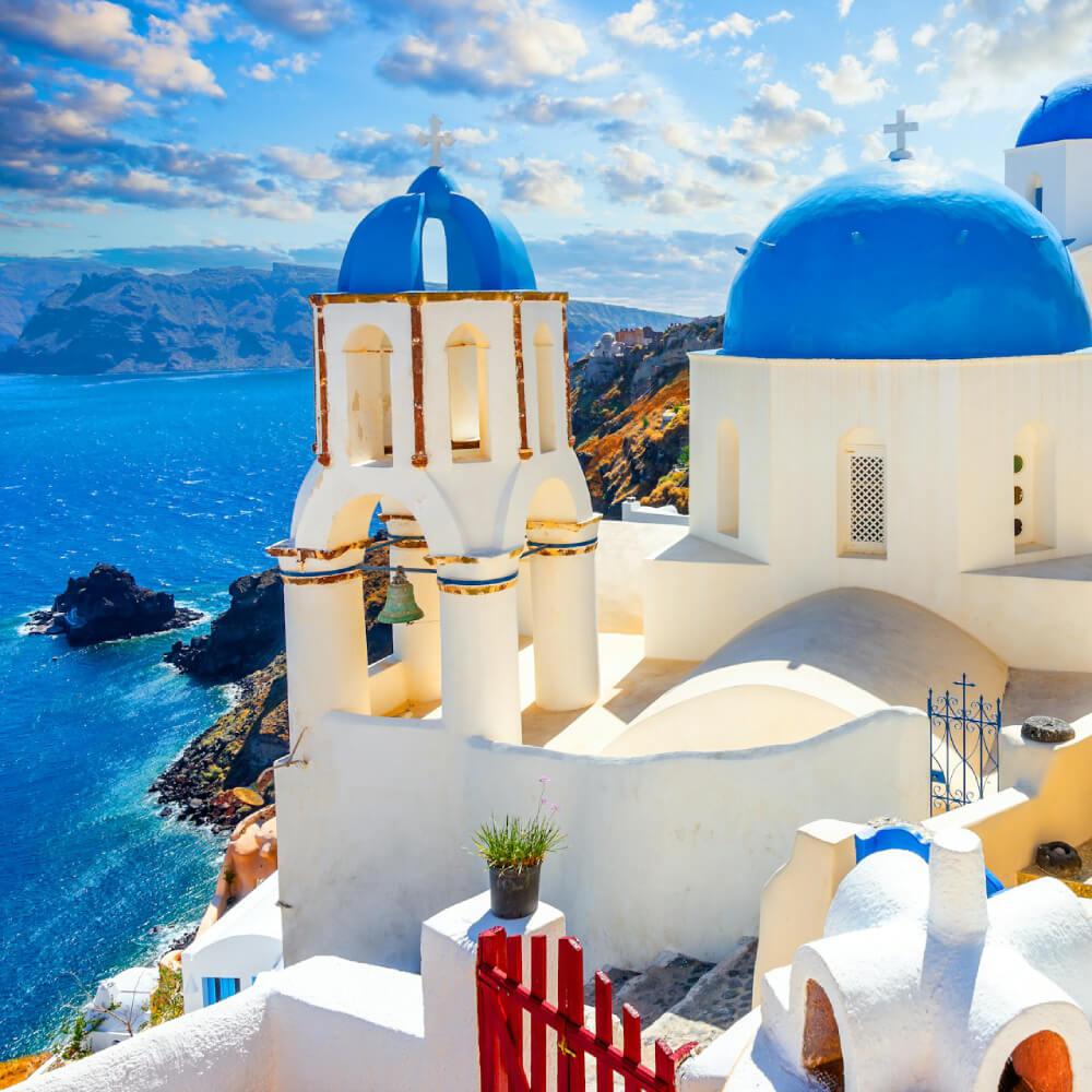 Blue-domed churches above the caldera in Oia, Santorini