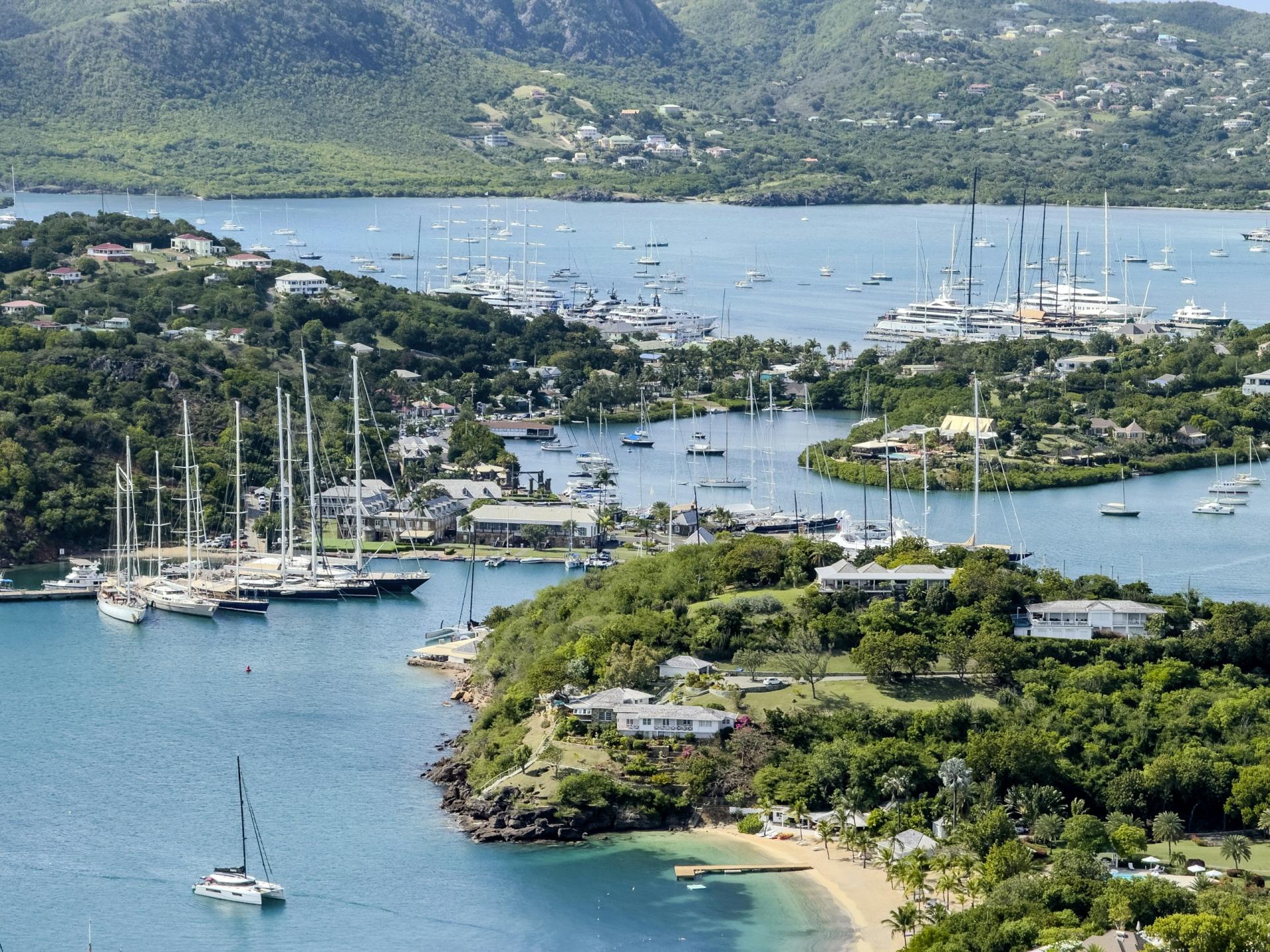 Sailing yachts and sheltered harbours surrounded by green hills in Antigua and Barbuda