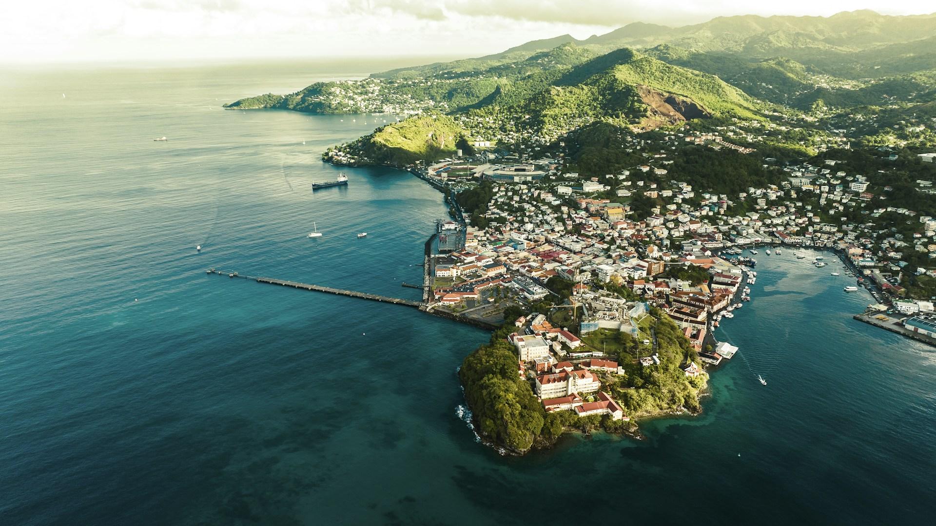 Aerial view of St George’s harbour and coastal buildings in Grenada