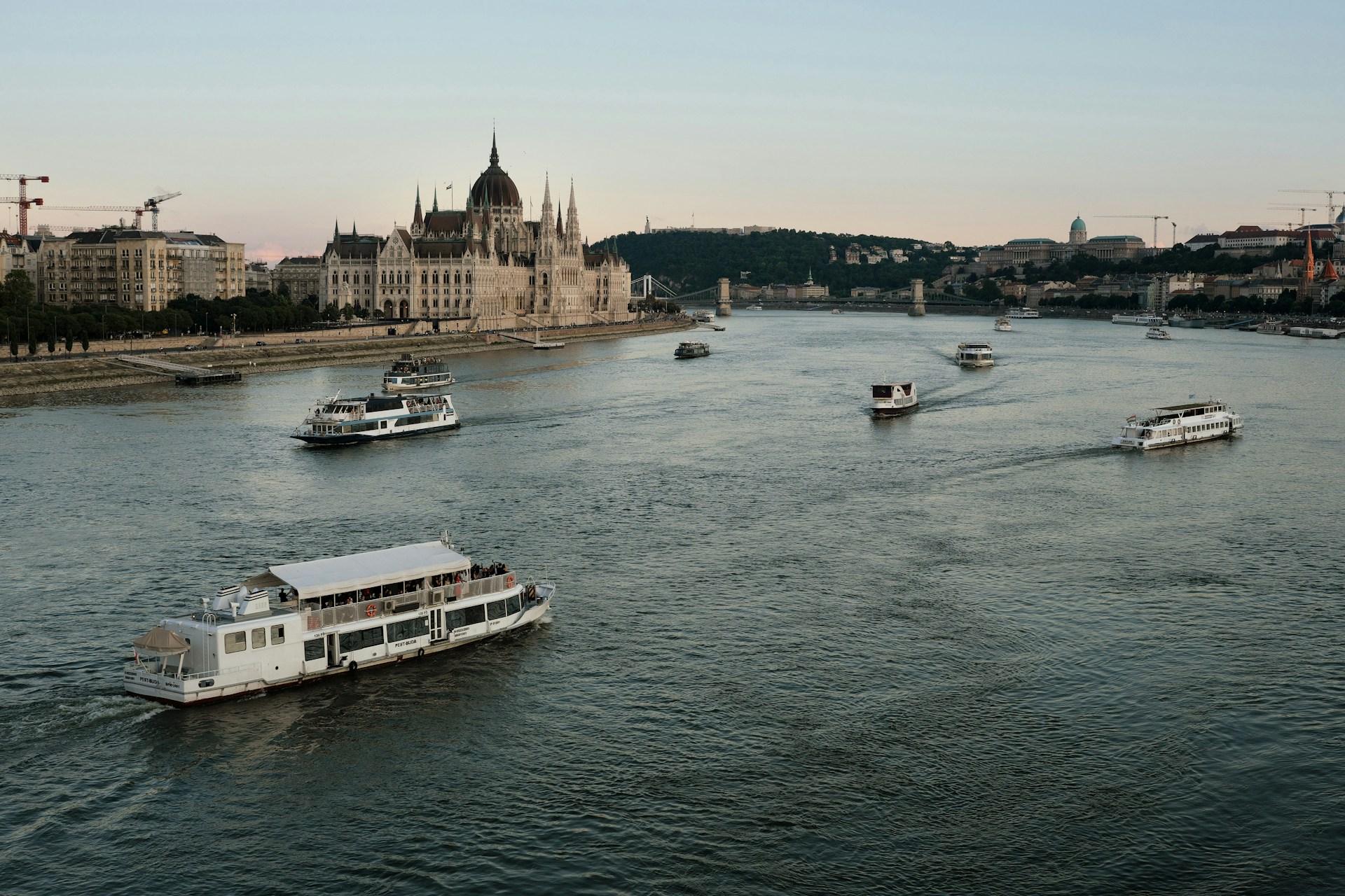 Boats on the Danube beside the Hungarian Parliament Building in Budapest