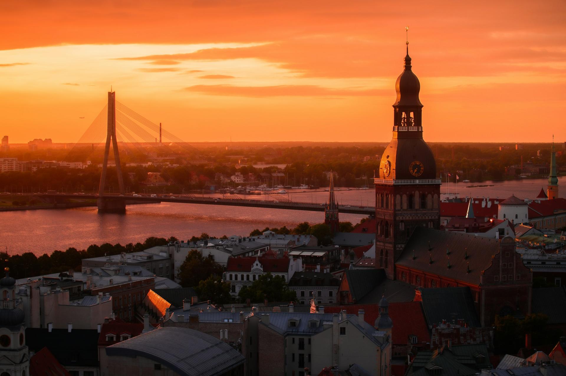 The Daugava River, bridge and Riga skyline at sunset in Latvia