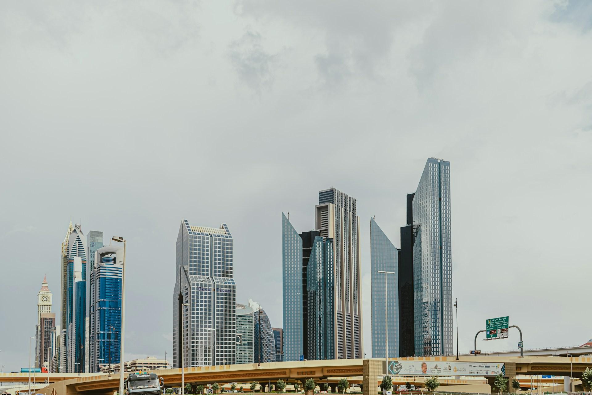Modern office towers and a road bridge in central Dubai